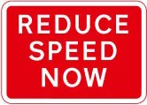 REDUCE SPEED NOW plate