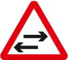 Two-way traffic crosses a one-way road