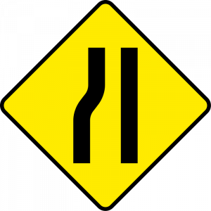 Road narrows from left