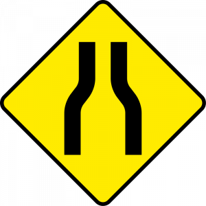 Road narrows on both sides